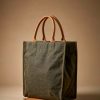 Olive waxed canvas tote with tan leather handles