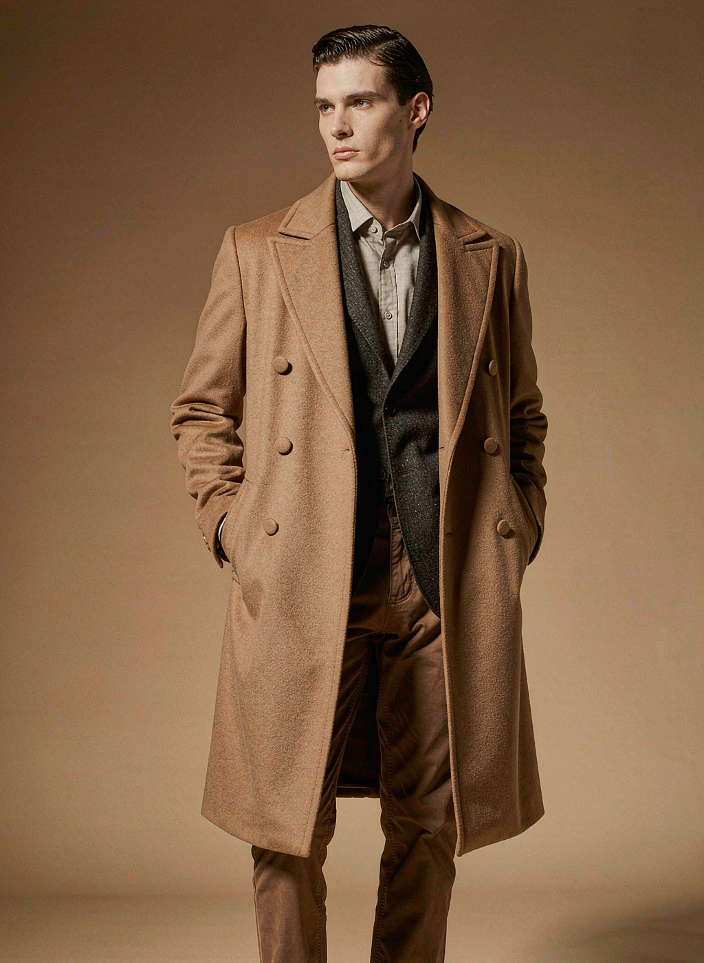 Model wearing a camel wool overcoat, menswear category